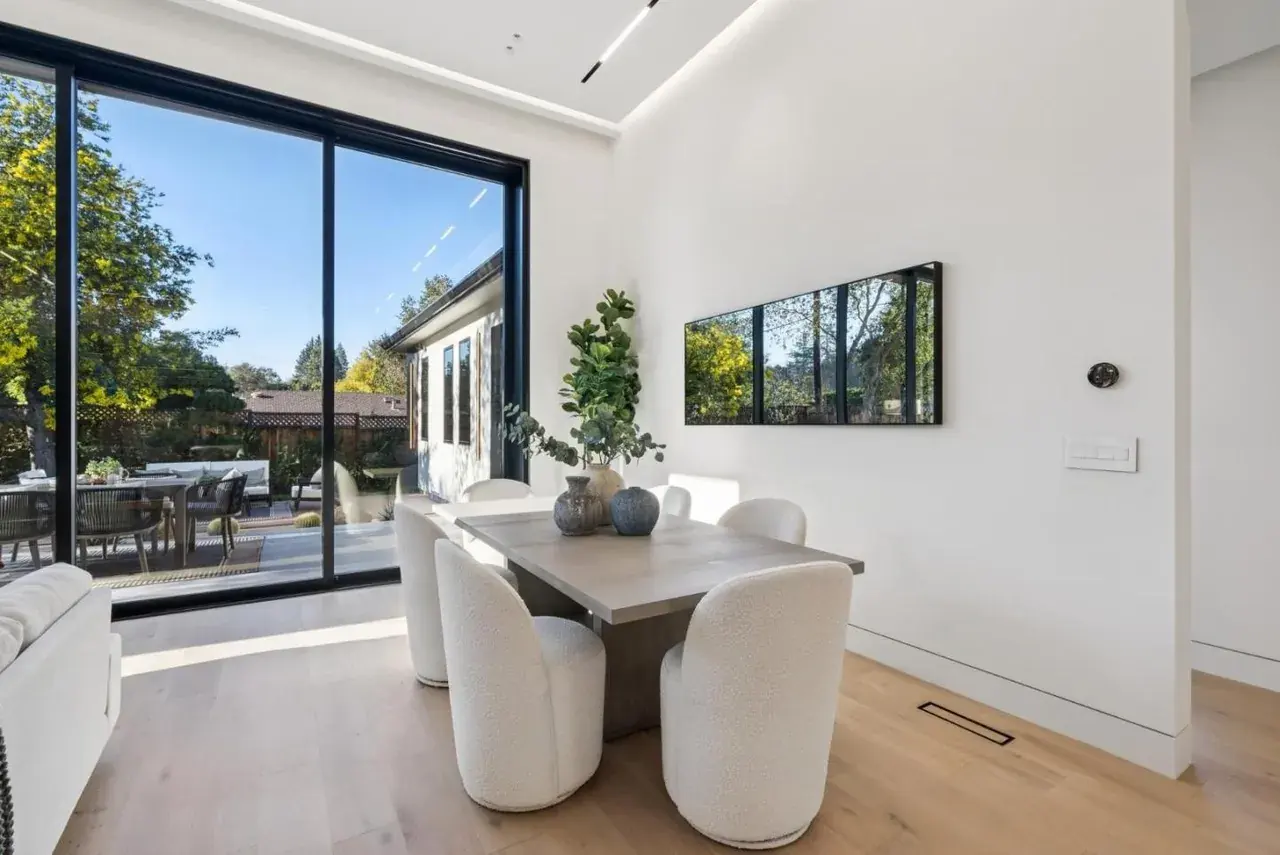 Dining table beside sliding doors onto the garden