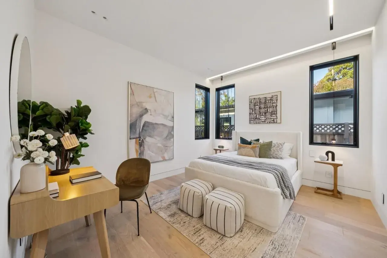 Bedroom with a writing desk under a window