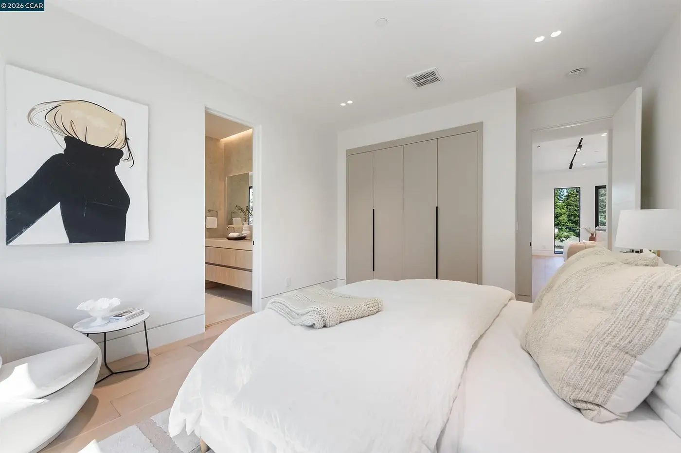 Bedroom with a clean plaster ceiling and no visible fixtures